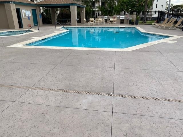 view of swimming pool with a patio area