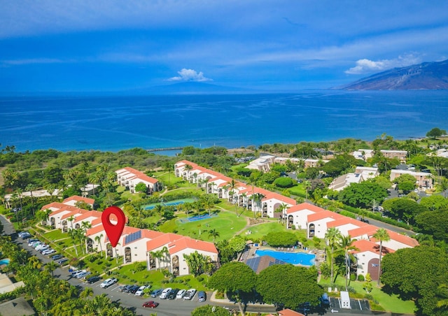 bird's eye view featuring a water view and a residential view