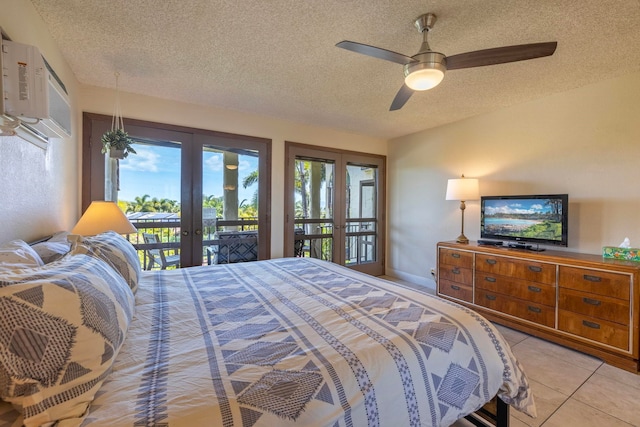 bedroom featuring light tile patterned floors, french doors, access to exterior, ceiling fan, and a textured ceiling