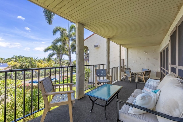 balcony with a sunroom and outdoor lounge area