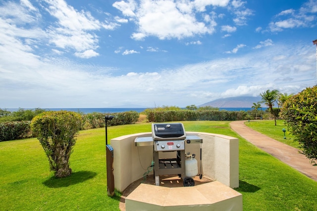 view of patio featuring a grill and a mountain view