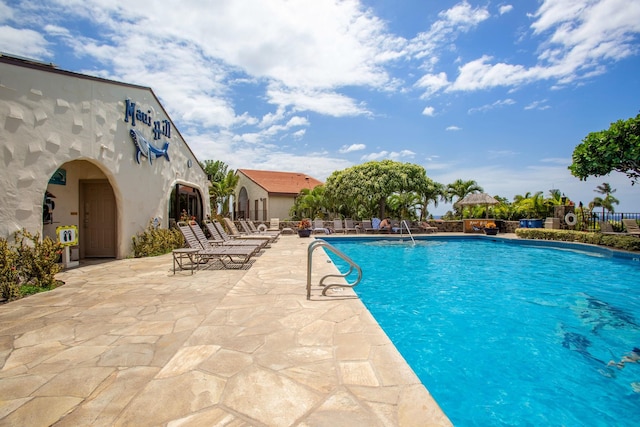 view of swimming pool featuring a patio