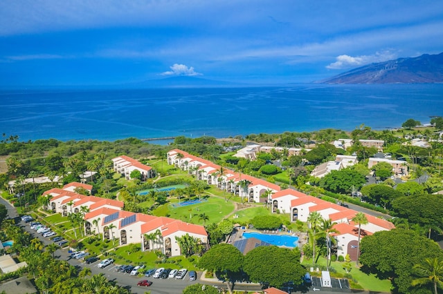 aerial view featuring a water and mountain view