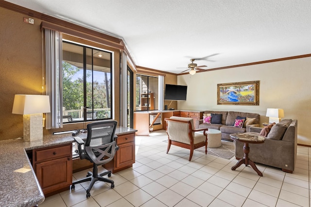 tiled living room with ceiling fan, ornamental molding, and a textured ceiling