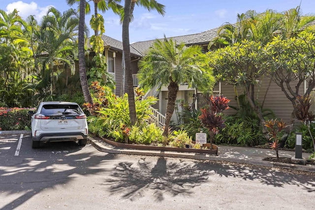 view of property hidden behind natural elements