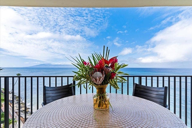 balcony featuring a water view