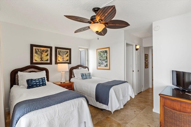 bedroom featuring a textured ceiling and ceiling fan