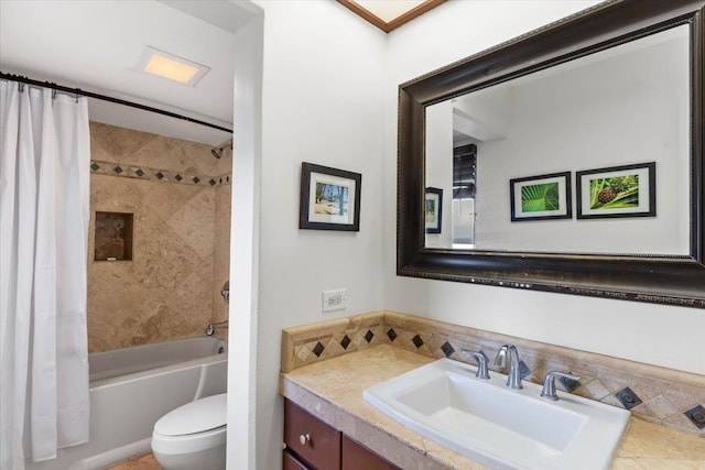 full bathroom featuring vanity, toilet, and shower / bath combination with curtain