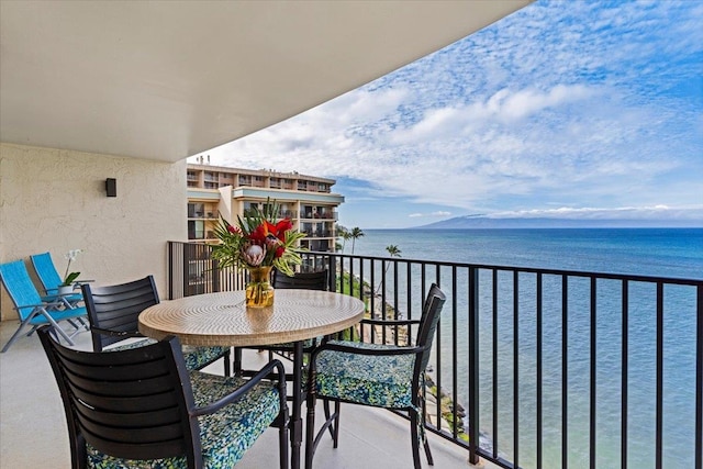 balcony featuring a water view