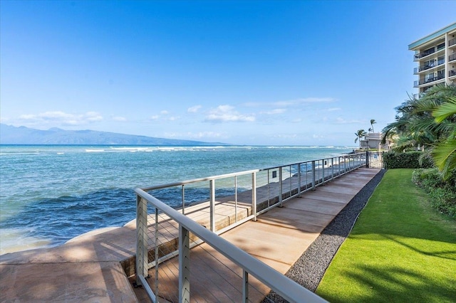 view of dock featuring a water and mountain view