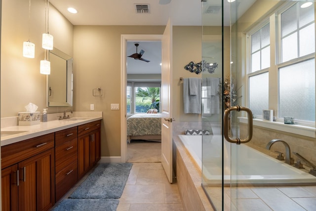 2563 Umeke Cir Unit 64, Kihei, HI 96753 - bathroom with double vanity, a bath, connected bathroom, tile patterned floors, and baseboards