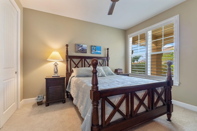 2563 Umeke Cir Unit 64, Kihei, HI 96753 - bedroom with light colored carpet, baseboards, and ceiling fan
