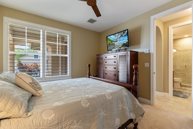 2563 Umeke Cir Unit 64, Kihei, HI 96753 - bedroom featuring light carpet, baseboards, a ceiling fan, and connected bathroom