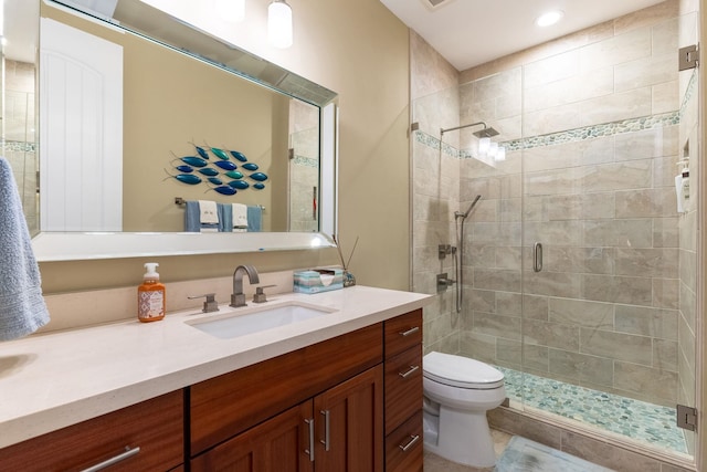 2563 Umeke Cir Unit 64, Kihei, HI 96753 - bathroom with vanity, a shower stall, toilet, and recessed lighting