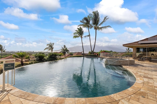 2563 Umeke Cir Unit 64, Kihei, HI 96753 - view of pool with a patio, a pool with connected hot tub, and a mountain view