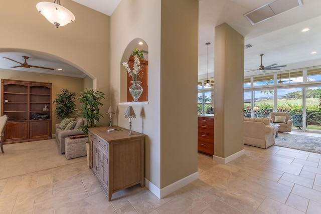 2563 Umeke Cir Unit 64, Kihei, HI 96753 - corridor with healthy amount of natural light, a towering ceiling, baseboards, arched walkways, and recessed lighting
