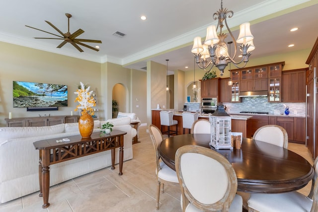 2563 Umeke Cir Unit 64, Kihei, HI 96753 - dining space with ornamental molding, recessed lighting, a chandelier, arched walkways, and a ceiling fan