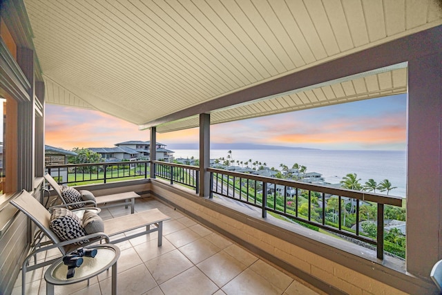 balcony at dusk with a water view