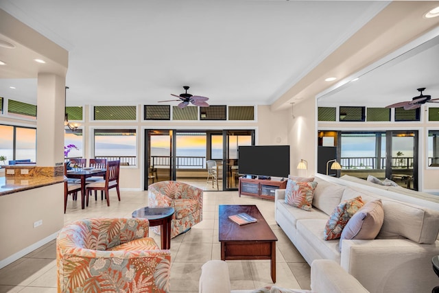 living area with recessed lighting, ceiling fan, and a healthy amount of sunlight