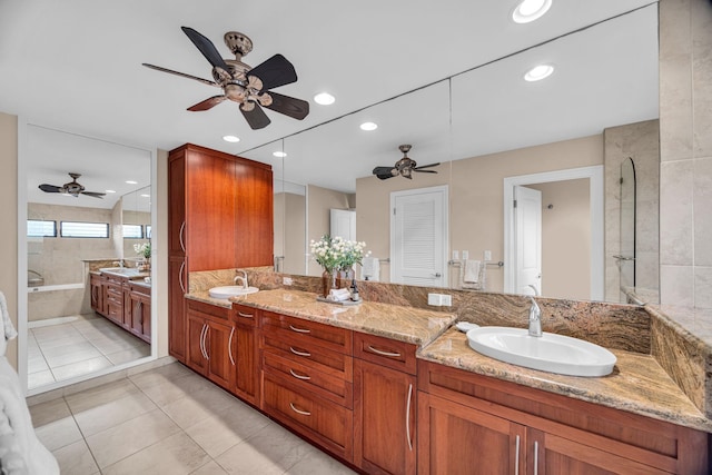 bathroom with double vanity, a sink, a ceiling fan, and recessed lighting