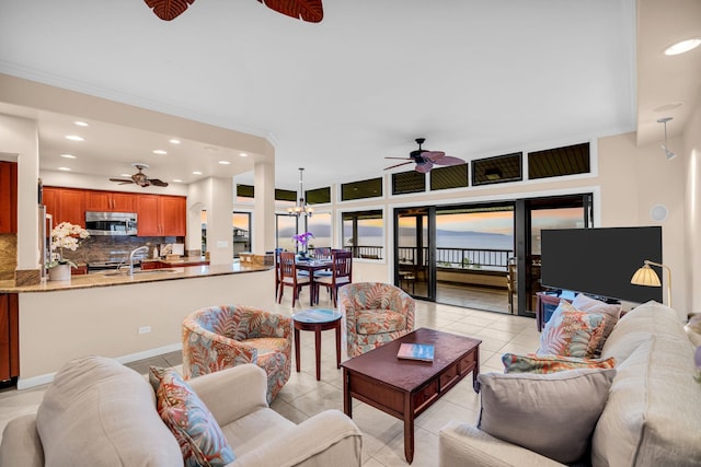 living room featuring recessed lighting, ceiling fan, and light tile patterned floors
