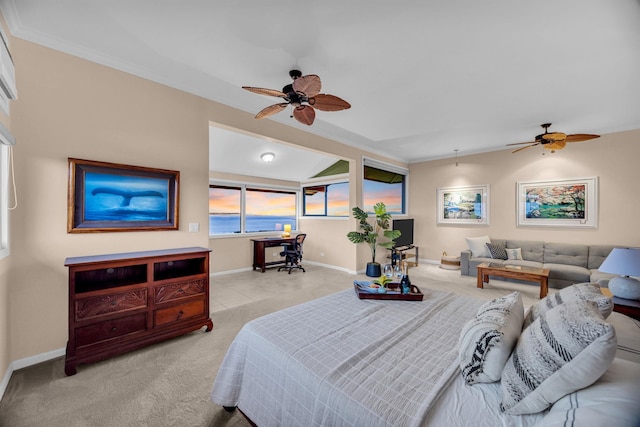 carpeted bedroom with crown molding, a ceiling fan, and baseboards