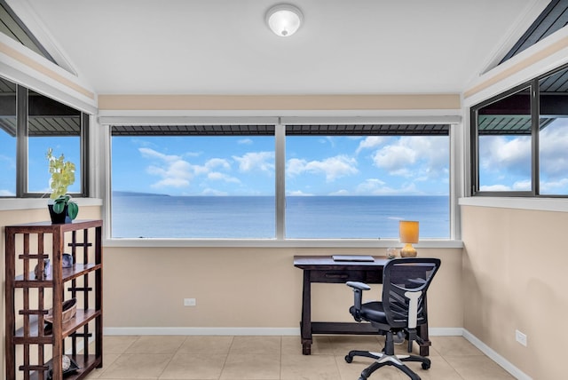 office space featuring tile patterned flooring, a wealth of natural light, baseboards, and lofted ceiling