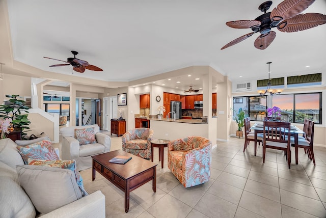 living room featuring recessed lighting, ceiling fan, and baseboards
