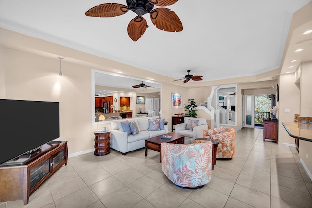 living room with a ceiling fan, recessed lighting, light tile patterned floors, and stairway