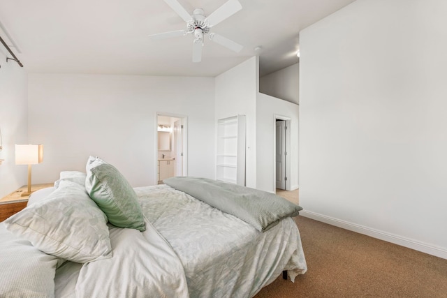 carpeted bedroom featuring high vaulted ceiling, ensuite bath, and ceiling fan