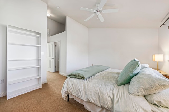 carpeted bedroom featuring ceiling fan and lofted ceiling