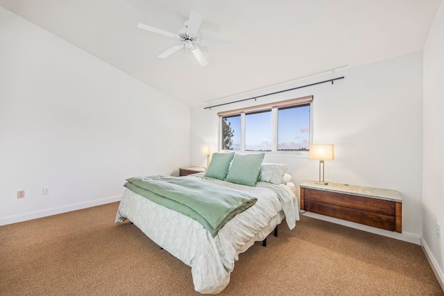 carpeted bedroom featuring ceiling fan and vaulted ceiling