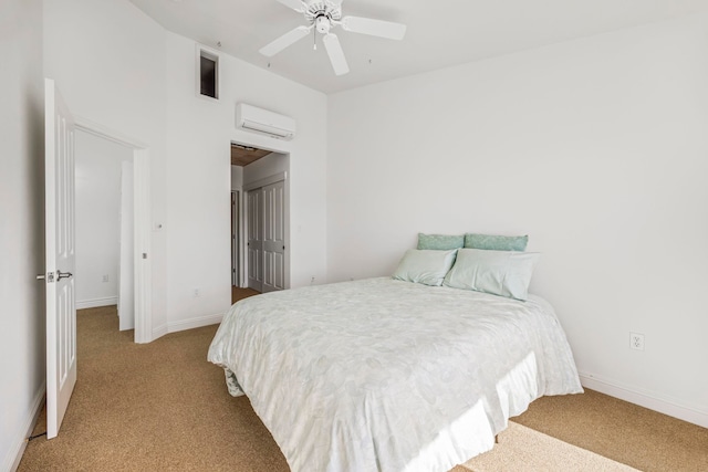 bedroom featuring an AC wall unit, ceiling fan, and light colored carpet