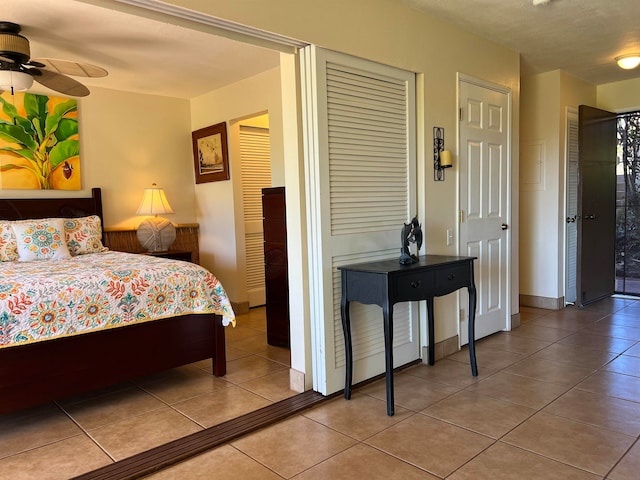 tiled bedroom with ceiling fan