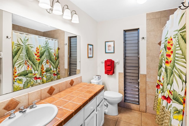 50 Kepuhi Pl Unit 128, Maunaloa, HI 96770 - bathroom with vanity, tile patterned flooring, toilet, and curtained shower