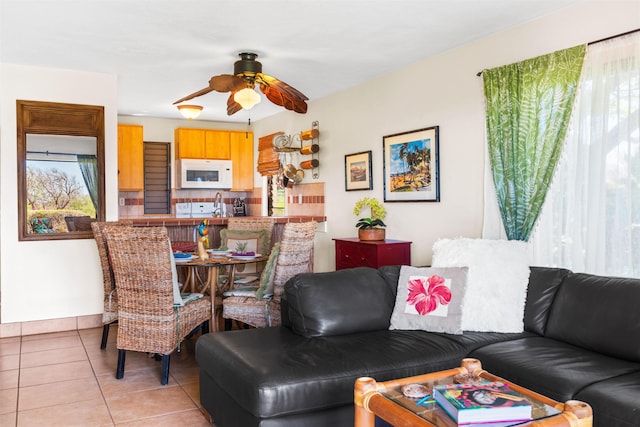 50 Kepuhi Pl Unit 128, Maunaloa, HI 96770 - living area featuring light tile patterned floors and ceiling fan