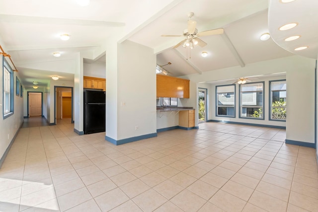 unfurnished living room with ceiling fan, light tile patterned floors, and lofted ceiling with beams