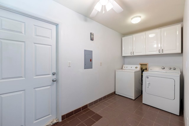 washroom with dark tile patterned flooring, cabinets, independent washer and dryer, ceiling fan, and electric panel