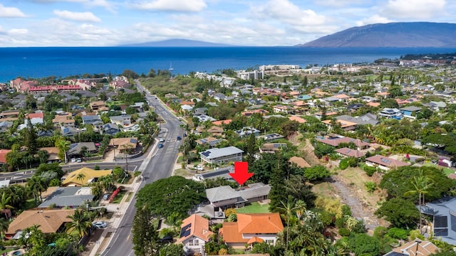 bird's eye view with a water and mountain view