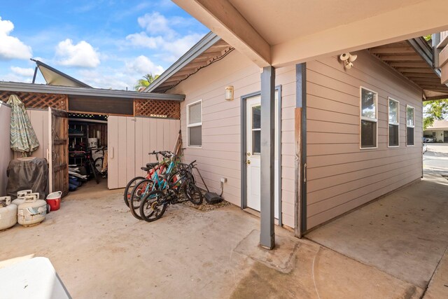 view of side of property with a patio