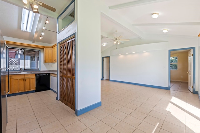 kitchen featuring sink, dishwasher, vaulted ceiling with beams, and light tile patterned flooring