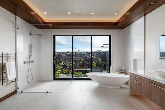 210 Naio Pl, Lahaina, HI 96761 - bathroom with a raised ceiling, vanity, a marble finish shower, a soaking tub, and a towel warming rack