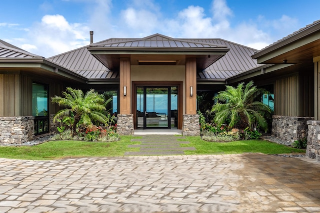 210 Naio Pl, Lahaina, HI 96761 - property entrance with a standing seam roof, metal roof, and stone siding