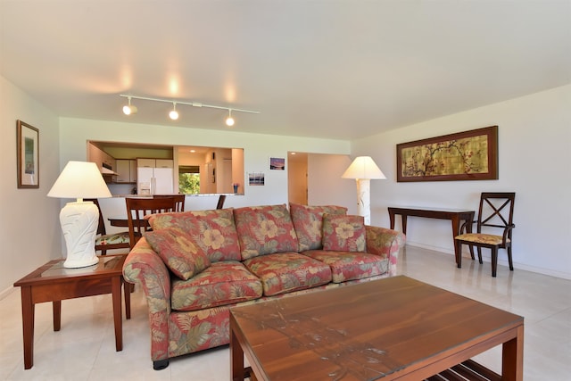 living room featuring track lighting and light tile patterned floors