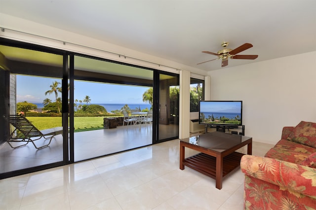 tiled living room with ceiling fan