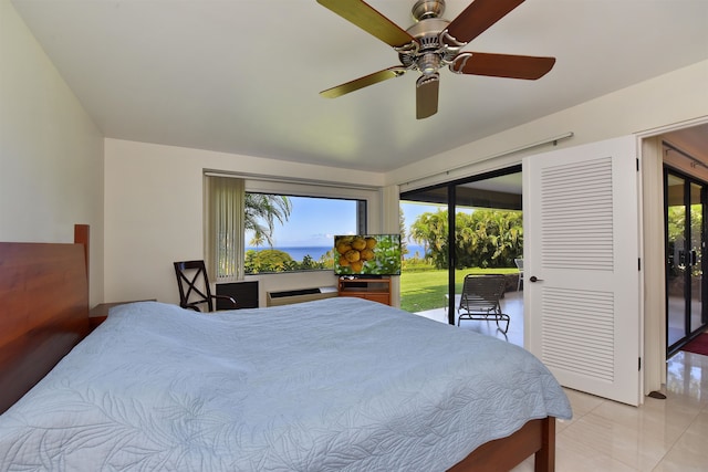 bedroom with access to exterior, ceiling fan, and light tile patterned flooring