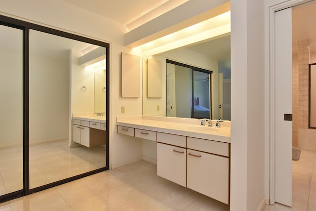 bathroom with tile patterned flooring and vanity