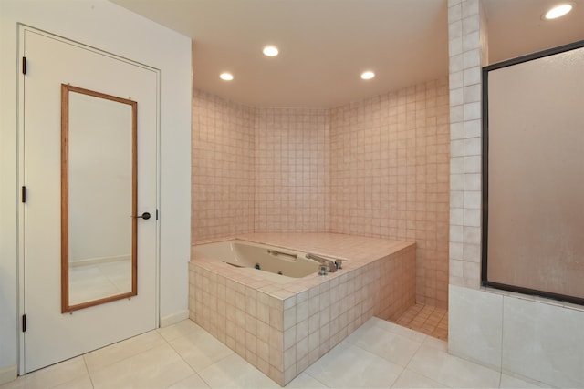 bathroom featuring tile walls, tile patterned floors, and plus walk in shower