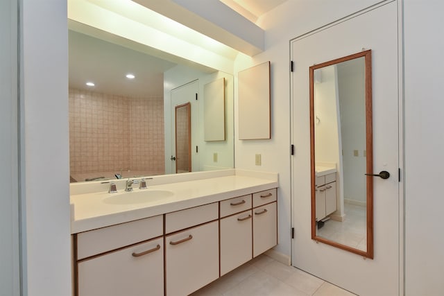 bathroom featuring vanity, tile patterned floors, and shower with separate bathtub