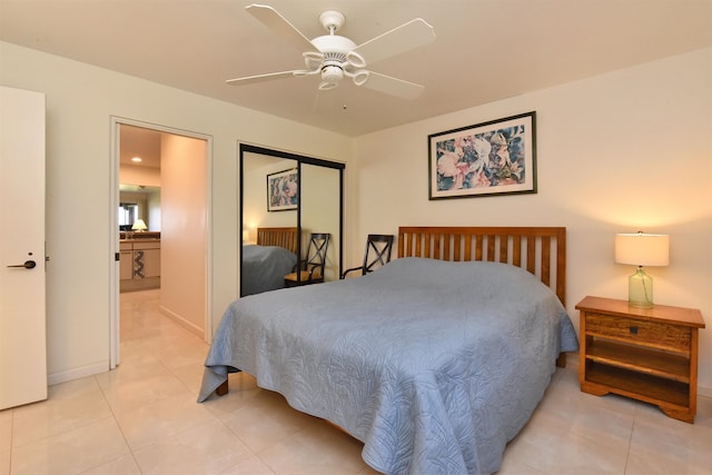 tiled bedroom featuring ceiling fan and a closet